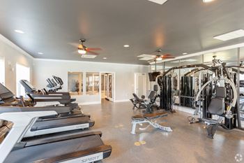 a gym with treadmills and other exercise equipment at The Venue at 109 Apartments , Tennessee, 37090
